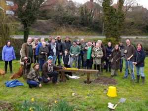 Members of the local area gathered around a newly installed bench
