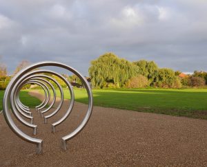 circular bike racks overlooking field