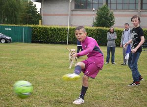 Young lad kicks football