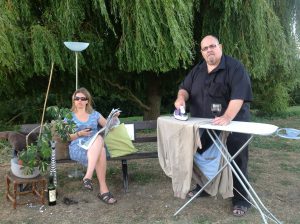 Ironing and reading the newspaper around the bench