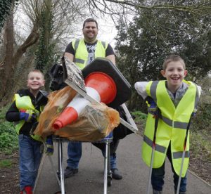 Photo of a family returning with their litter finds